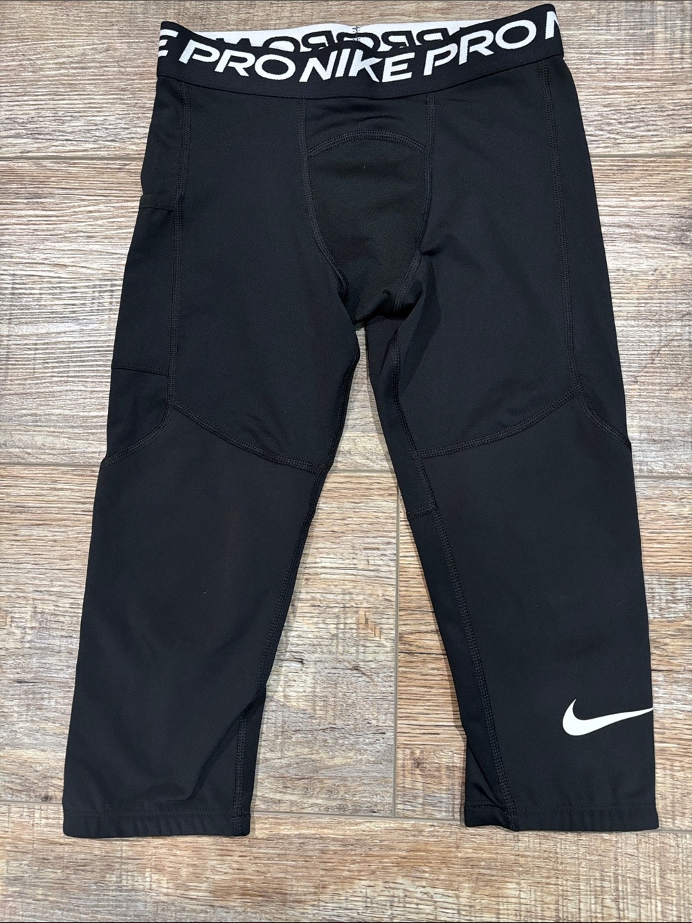 Nike Pro compression pants, mid length. Black, youth medium